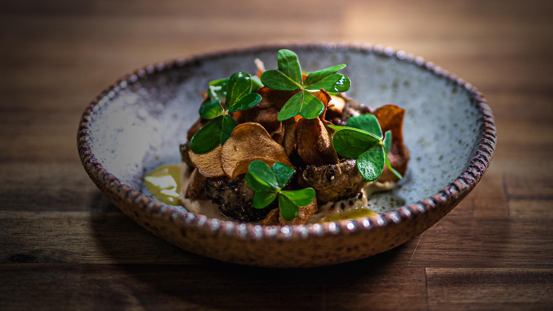Native Australian plated dish with wood sorrel and crisps